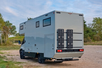 Off road camper 4x4, rv motor home on nature. Travel with motorhome truck. 4x4 mobile home.