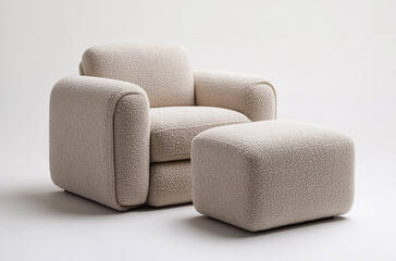 an armchair with a matching ottoman upholstered in soft fabric