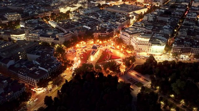 Madrid in the evening drone view, downtown Madrid with night lights, Puerta de Alcala crossroads in Madrid aerial view, capital of Spain at night