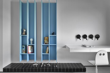 A contemporary modern minimalist room featuring stylish blue shelves and a functional workspace