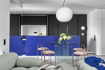 A Modern Living Room and Kitchen Intertwined with Striking and Vibrant Blue Accents