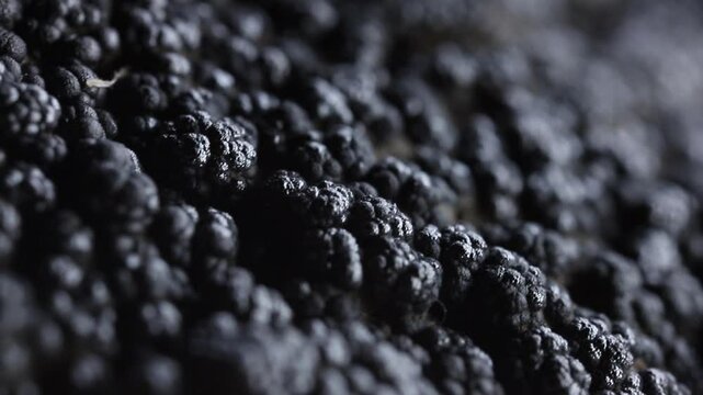 Raw iron ore extreme close up. Rotation movement.  Futuristic background