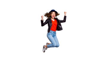 Full length photo of delighted crazy lady raise her fists scream yeah jump celebrate victory wear denim jeans good clothes isolated over yellow color background