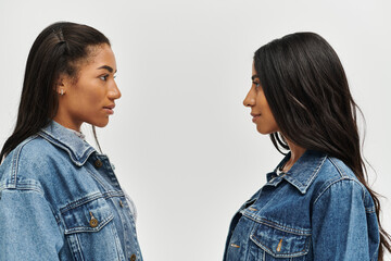 A fashionable young woman poses confidently in chic denim wear, highlighting her unique style.
