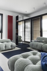 A modern living room with stylish seating and a sleek design, combining comfort and elegance