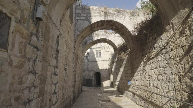 Travelling in shot of narrow pathway at Old City of Jerusalem, Israel