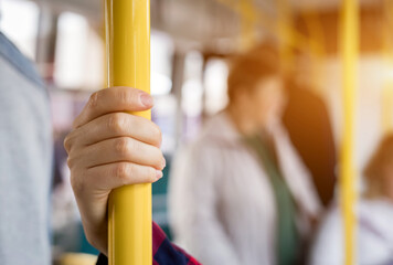 close up hand holds the handrail