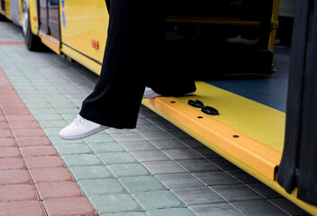 Woman gets off bus