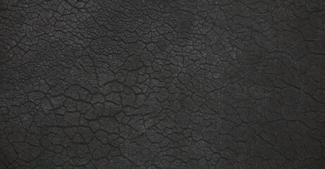 abstract halloween background of black surface with cracks