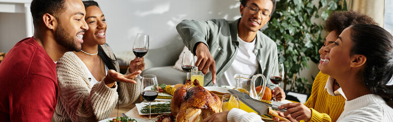 A warm gathering of friends enjoying Thanksgiving dinner, sharing laughter and food.