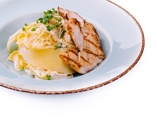Elegant grilled chicken breast with cheese and cream sauce