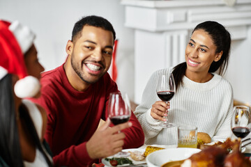 Friends gather to share Christmas treats and laughter around the table.