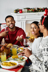 Friends gather around a festive table, sharing delicious food and happy moments during Christmas.