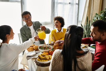 Friends toast glasses and share laughter while enjoying a Thanksgiving feast together at home.