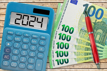 New financial year 2024 - Budget 2024 concept with calculator and European euro banknote