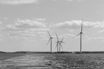 Wind turbine against the sea. Concept of green, clean, renewable energy.