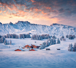 Untouched winter landscape. Amazing morning view of Alpe di Siusi village. Cold winter scene of Dolomite Alps. Popular ski resort in Ityaly, Europe at December. Traveling concept background.