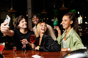 Colleagues celebrate together, sharing laughter and drinks at a vibrant corporate party.