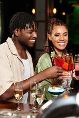 Colleagues toast in a joyful atmosphere of cheers and camaraderie.