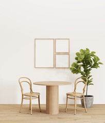 a wooden table and two chairs with a plant in the corner and frame on the wall for decor