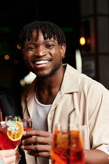 Lively young man during a corporate celebration event.