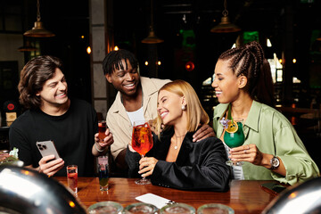 Young professionals enjoy drinks and laughter at a vibrant corporate party atmosphere.