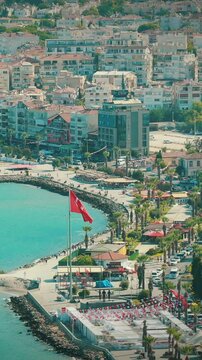 Kusadasi, Aydin, Ayd n Province, Turkey. Waterfront And Kusadasi Cityscape In Sunny Summer Evening. Scenic View Of Kusadasi Skyline At Aegean Coast, Turkey