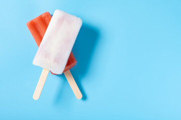 top view fresh popsicles on a blue background