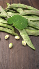 Pile of green beans over wooden background, Healthy food concept