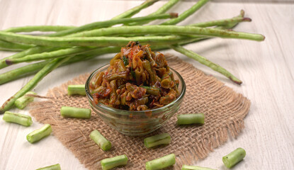 French beans with stewed green peas on wooden background. Healthy food concept.