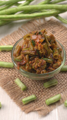 French beans with stewed green peas on wooden background. Healthy food concept.