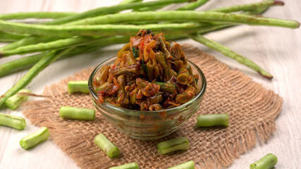 French beans with stewed green peas on wooden background. Healthy food concept.