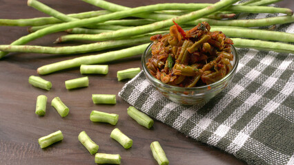 French beans with stewed green peas on wooden background. Healthy food concept.
