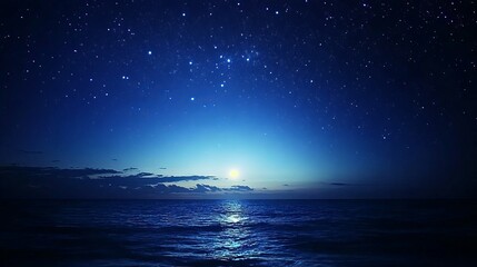 A stunning natural spectacle typically found in remote areas with minimal light pollution, where countless stars illuminate the deep blue night sky, creating a breathtaking celestial display.