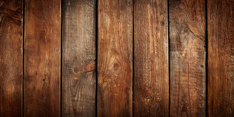 Panoramic background of old wooden planks in warm dark brown tones with a rustic weathered finish, arranged vertically