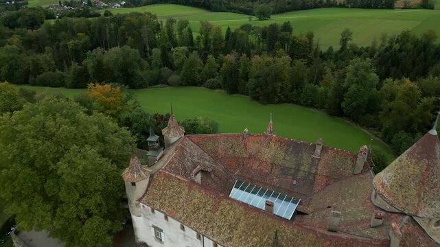 Pull out drone shot above nice Oron Castle in Vaud Switzerland