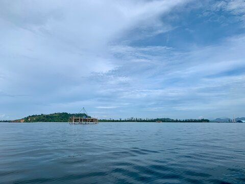 view from a distance of an island with the shape of a tablespoon