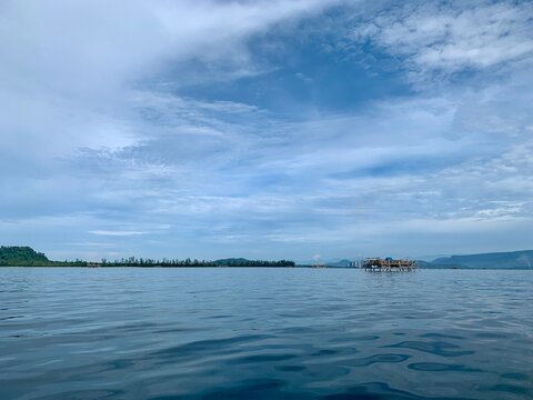 view from a distance of an island with the shape of a tablespoon