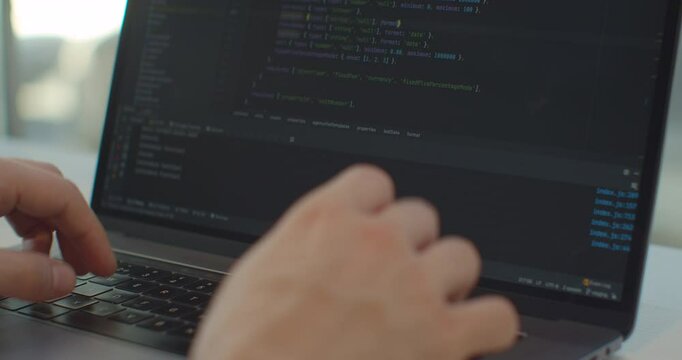 Closeup coding on screen, Man hands coding html and programming on screen laptop, development web, developer.
