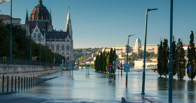 Budapest, Hungary - September 22, 2024: Rising Waters Flood the Highway Outside Budapest's Parliament in the Aftermath of Storm 'Boris'. Timelapse, slide transition. Early morning.