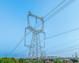 High voltage electricity towers on a sunny day