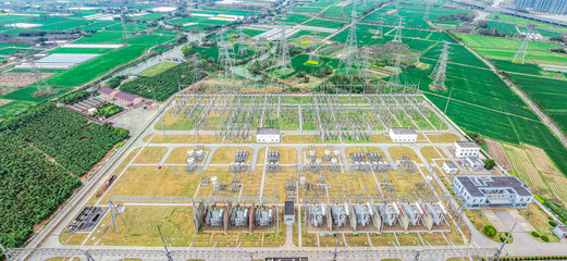 Aerial view of high voltage substation electricity tower industrial equipment landscape
