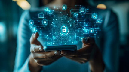 Fototapeta premium Cybersecurity concept: person holding smartphone with digital lock icons for data protection and privacy