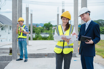 Construction engineers discussion with architects at construction site or building site.