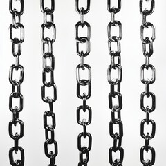 Close-up of shiny metallic chains hanging vertically against a white background.
