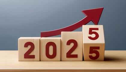 Wooden blocks displaying the year 2025 with an upward graph arrow, symbolizing growth and future success.