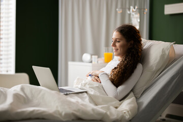 Using her tablet, the patient engages in a virtual consultation with healthcare professionals, ensuring continuous care and monitoring.