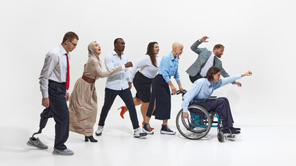 Diverse group of professionals in motion, moving forward, dynamic team-building exercise, symbolizing unity, motivation and collective effort workplace. Concept of business, dei, equality, support