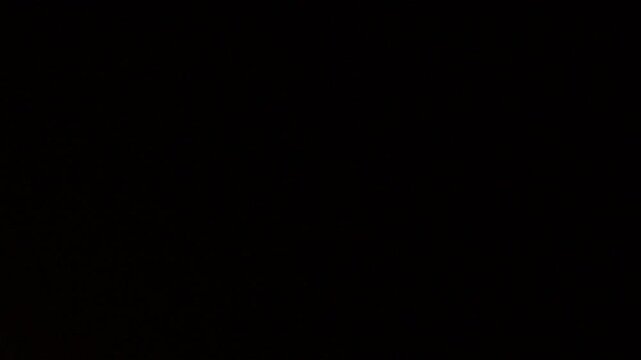 Moon supermoon timelapse in the September night sky seen from The Netherlands during a hazy evening.