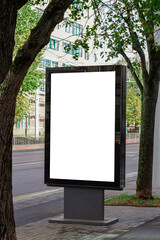 Vertical blank white street billboard in the city. Advertising banner with copy space. Mock up